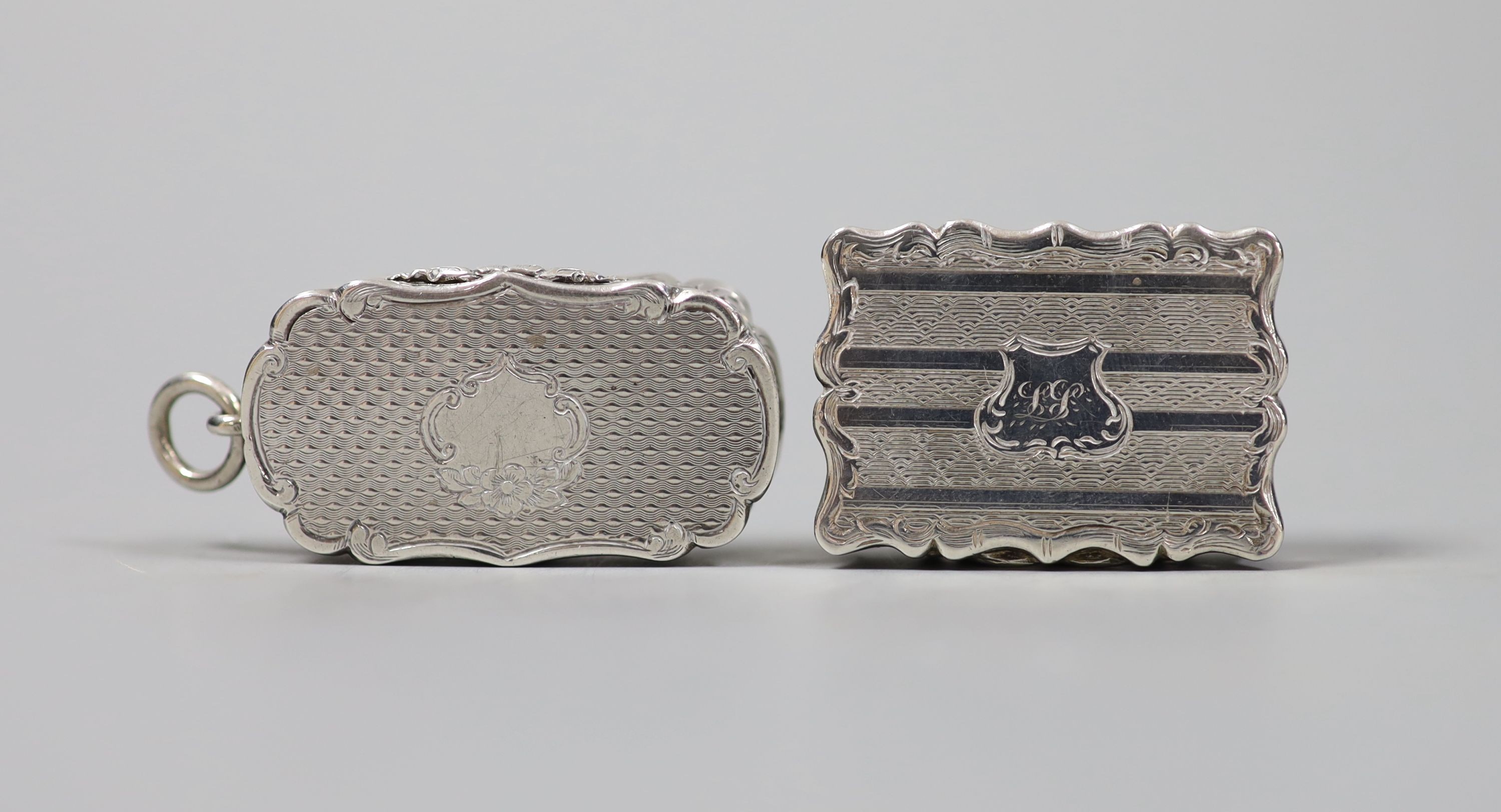 Two Victorian silver vinaigrettes, Birmingham, 1857 and Birmingham, 1851, largest 41mm.